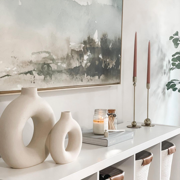 Circular donut shaped off-white/cream ceramic vases